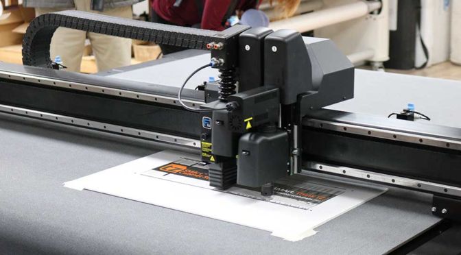 Plum Grove Invests in Vanguard VR5D-E Flatbed LED UV Printer & Summa F1612 Flatbed Cutter